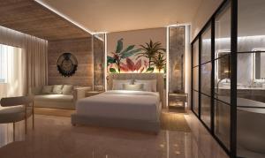 Un dormitorio con una cama blanca y un baño. en Grand Sunset Princess - All Inclusive, en Playa del Carmen