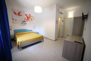 Postel nebo postele na pokoji v ubytování Hotel Albatros