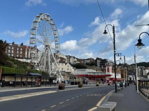 a ferris wheel in the middle of a street at The Grand Scarborough in Scarborough +29 photos