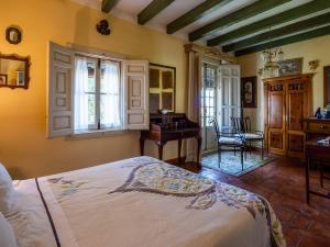 Ένα ή περισσότερα κρεβάτια σε δωμάτιο στο La Casa del Obispo