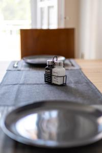 a camera sitting on top of a table with a plate at Liakos' Apartments in Vasiliká