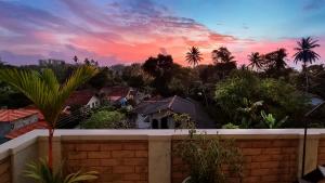 a view of a sunset from a house at Black Pearl Apartments - with free snorkeling Mirissa in Mirissa +43 photos