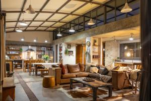 a living room with a couch and a table at Mountain View Villa in Springbok