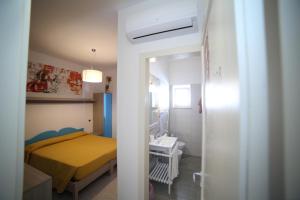 Postel nebo postele na pokoji v ubytování Hotel Albatros