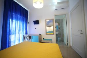 Postel nebo postele na pokoji v ubytování Hotel Albatros
