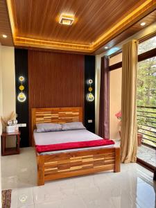 a bedroom with a wooden bed in a room at Chapis Transient Home in Baguio