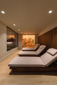 two beds in a room with a wall at MS Aguamarina Costa del Sol in Torremolinos