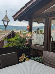 a view of a balcony with a table and chairs at Gästehaus Arracher Hof in Arrach