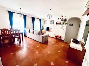 a living room with a couch and a table at Costa Suri Casa in Nerja