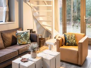a living room with two couches and a staircase at Modern Forest Retreat in Bergen in Bergen