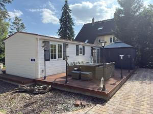 a small house with a deck in front of it at Am Zeißigwald in Chemnitz