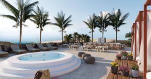 a pool on a resort with palm trees and chairs at Luxury resort in Jericoacoara