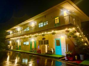 a house lit up at night with lights at FujiteraCanvas102 in Gotemba
