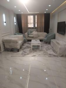 Posezení v ubytování Pyramids Gardens 37 H, 5th Floor