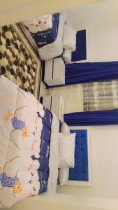 Postel nebo postele na pokoji v ubytování Pyramids Gardens 37 H, 5th Floor