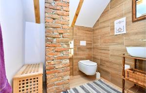 a bathroom with a white toilet and a sink at Kuća za odmor Dedino ognjište in Varaždin Breg +30 photos