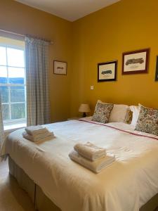 Ένα ή περισσότερα κρεβάτια σε δωμάτιο στο Fordie South Cottage