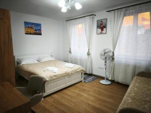 Ένα ή περισσότερα κρεβάτια σε δωμάτιο στο Polus Home