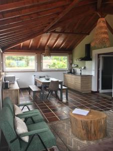 a living room with a couch and a table at The Hideaway at Quinta de Moçamedes - Suites & Apartments in Vouzela