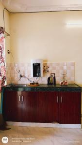a kitchen with a counter top in a room at AAK Hills stay villa in Kodaikānāl