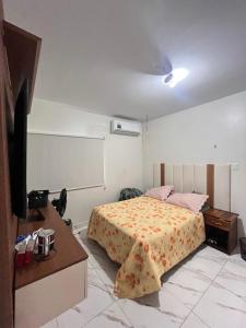 En eller flere senge i et værelse på Casa Almeida - sinta em casa na Cop 30 + 6 billeder