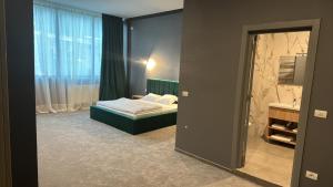 Postel nebo postele na pokoji v ubytování Complex Turistic Central + 22 fotografií