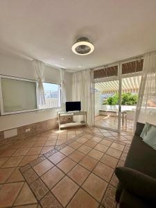 Μια τηλεόραση ή/και κέντρο ψυχαγωγίας στο Sea View Bungalow in Los Gigantes