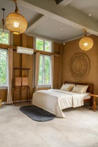 Ένα ή περισσότερα κρεβάτια σε δωμάτιο στο Nature Home near Colombo Airport