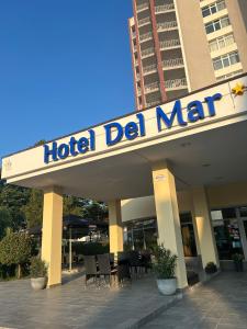 a hotel del mar sign on top of a building at Hotel Del Mar Venus in Venus
