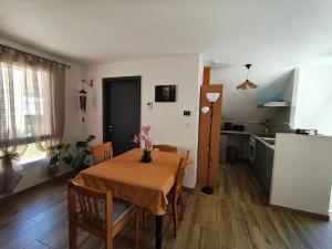 a kitchen and dining room with a table and chairs at BAN CHAILAI studio in Marckolsheim