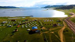 an aerial view of a farm next to a body of water at Ikh khorgo in Horgo