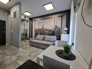 a living room with a couch and a table at Apartament in Legnica