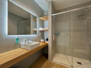 a bathroom with a sink and a shower at CoruñaFlat Apartamentos con encanto en el centro de A Coruña in A Coruña +44 photos