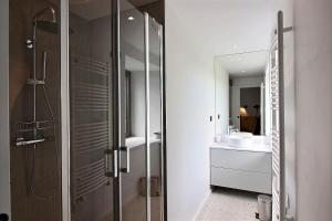 a bathroom with a shower and a sink and a mirror at A l'abri des pins in Pleubian +41 photos