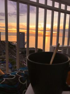 a bowl sitting on a table in front of a window at Seaside Manila Bay Sunset View at SM Mall of Asia in Manila
