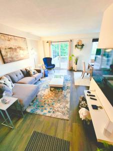 a living room with a couch and a table at Pickering Your home away from home in Pickering