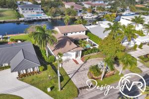 an aerial view of a house with palm trees at 7 BR Intercostal Beauty with Heated Pool in Hallandale Beach