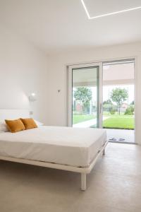 Katil atau katil-katil dalam bilik di Armonia Suites - Aria e Fuoco