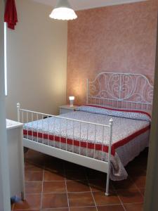 מיטה או מיטות בחדר ב-Azienda Agricola Carbone Cosimo