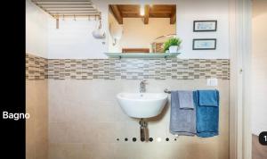 a bathroom with a sink and a mirror at Sardegna Relax House in Quartu SantʼElena +71 photos