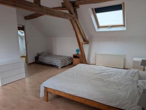 Ένα ή περισσότερα κρεβάτια σε δωμάτιο στο Maison Les Hiboux