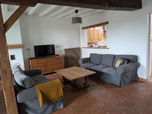 Χώρος καθιστικού στο Maison Les Hiboux