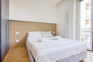 En eller flere senge i et værelse på Easylife - Milano - Torino 64 P2N6 - Duomo