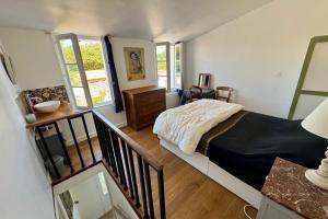 Una cama o camas en una habitación de Charming house with garden in Ars-en-Ré