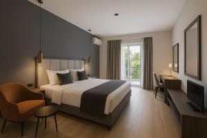 Un dormitorio con una cama, un escritorio y un televisor. en George Beach Studios, en Pefki