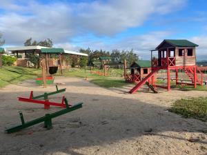 a park with a playground with a play structure at Flat 3 Mobiliado no Condominio Flats Monte Castelo - Gravatá PE in Bezerros