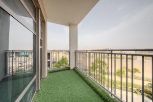 a balcony with a view of the beach at 2BR Private Apartment in Al Zahia, Sharjah - Stone Haven in Sharjah