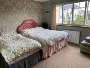 Postel nebo postele na pokoji v ubytování Caledonia House