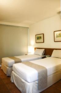 Ένα ή περισσότερα κρεβάτια σε δωμάτιο στο Concordia Hotel Bumi Sangkuriang Bandung