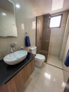 a bathroom with a sink and a toilet at Two-bedroom apartment in Santa Cruz de la Sierra